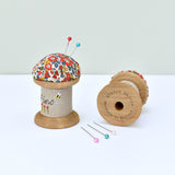 Pincushion, needle holder, sewing gift for made with a wooden bobbin and Liberty fabric handmade by Stitch Galore