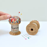Embroidered personalised Mummy pincushion, pin holder made using a wooden spool and Liberty fabric handmade by Stitch Galore