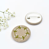 Embroidered mistletoe wreath badge, holly pin badge handmade by Stitch Galore