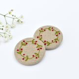 Embroidered holly wreath badge, holly pin badge handmade by Stitch Galore