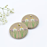 Embroidered badge with flowers and bee, floral pin badge handmade by Stitch Galore 
