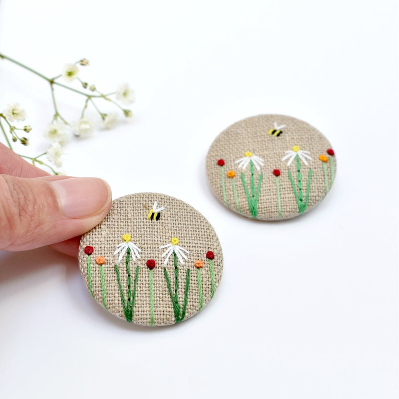 Fabric badge with embroidered flowers and bee, floral pin badge handmade by Stitch Galore 