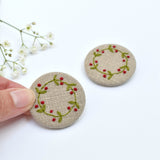 Embroidered holly wreath badge, holly pin badge handmade by Stitch Galore