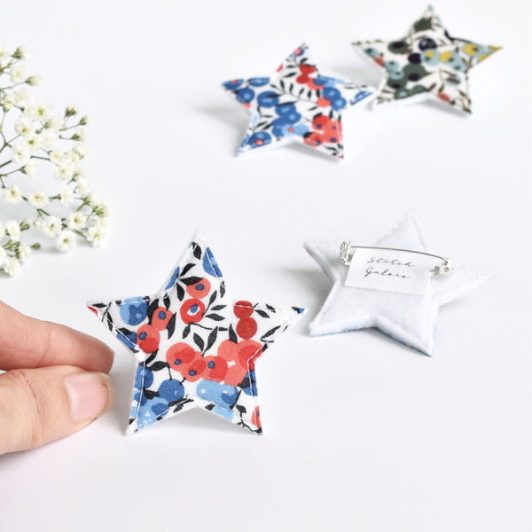 Christmas fabric star badge with red and blue berries, Liberty fabric star badge handmade by Stitch Galore