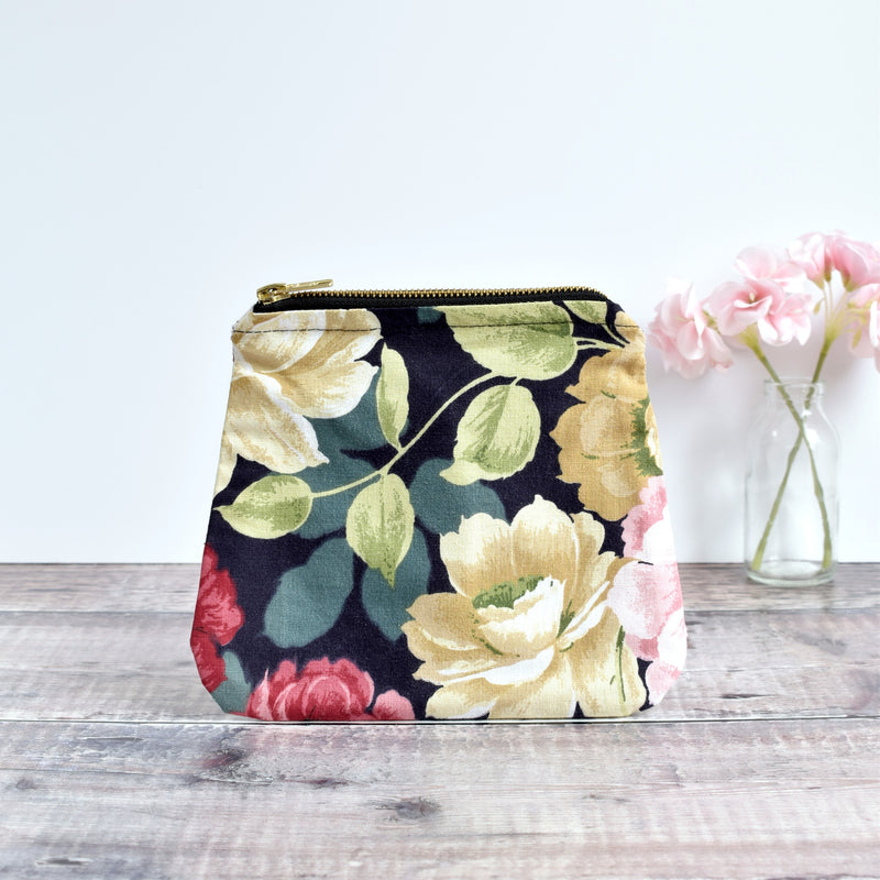 Zip pouch, makeup bag made from  black floral vintage fabric handmade by Stitch Galore