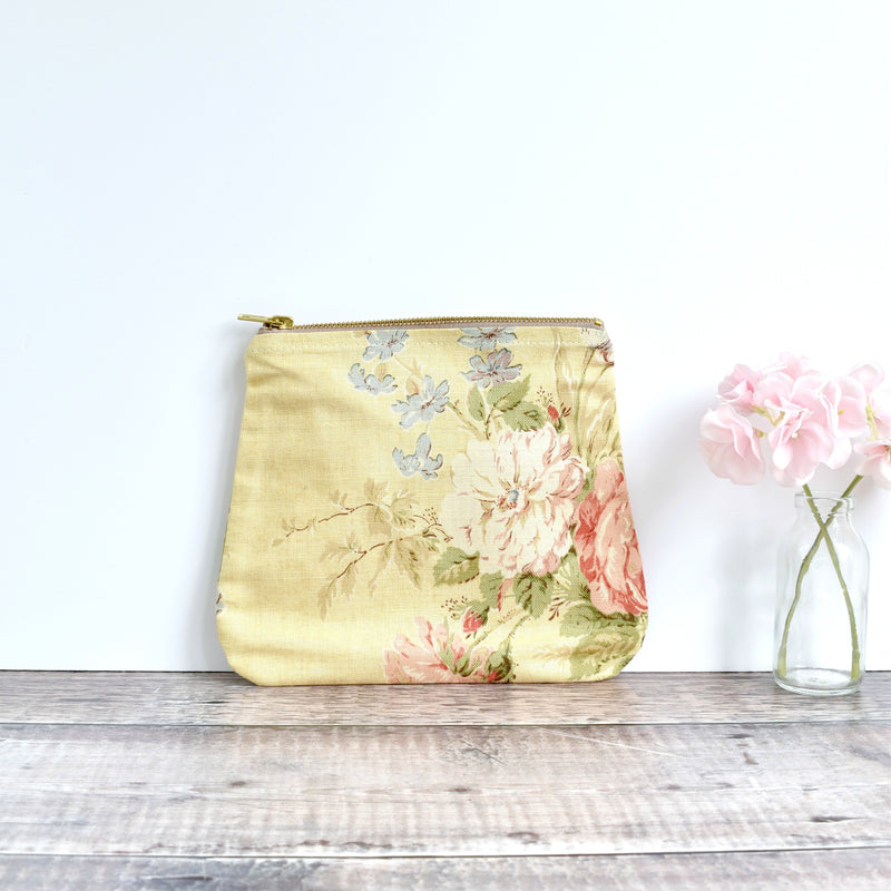 Zipper pouch, cosmetic bag made from yellow floral vintage fabric handmade by Stitch Galore