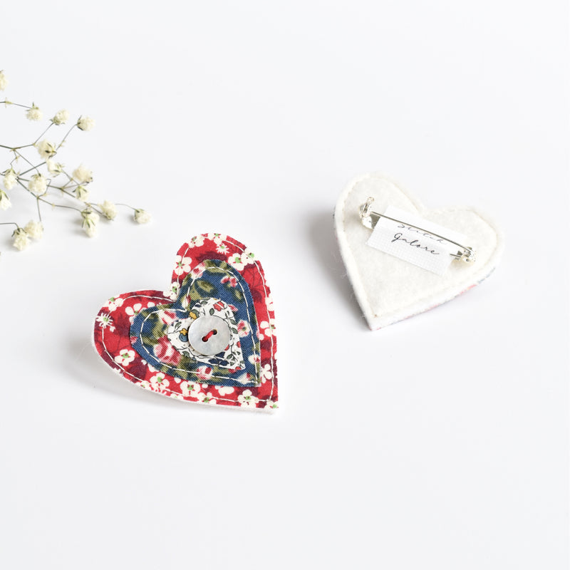 red liberty fabric heart brooch with button handmade by stitch galore