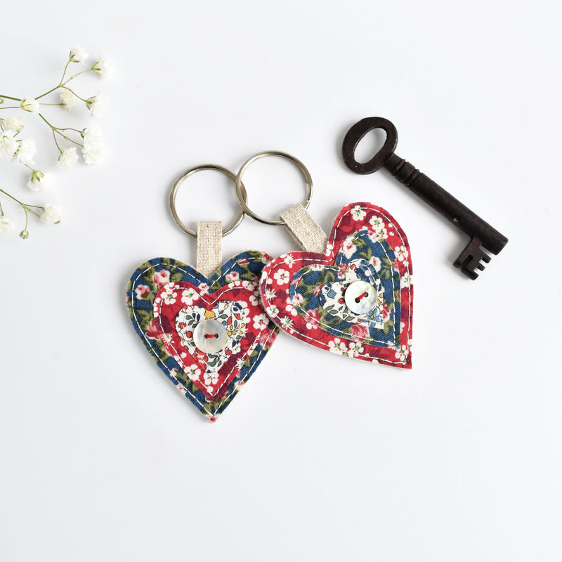 Sewn fabric heart key rings, blue and red liberty fabric heart keychain handmade by Stitch Galore