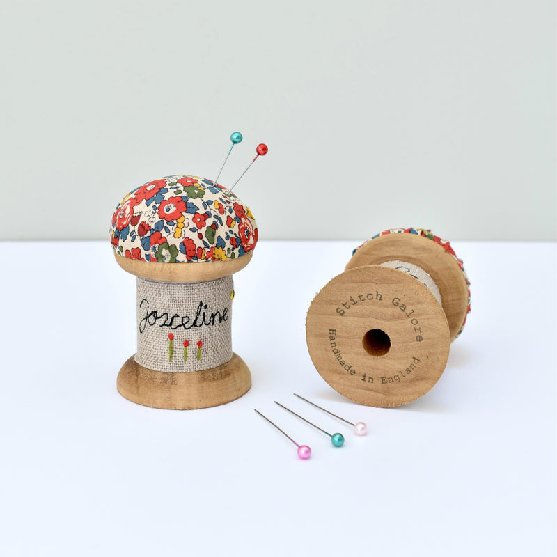 Pincushion, personalised sewing gift made with a wooden cotton reel and Liberty fabric handmade by Stitch Galore