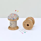 Pincushion, needle holder, sewing gift for made with a wooden bobbin and Liberty fabric handmade by Stitch Galore