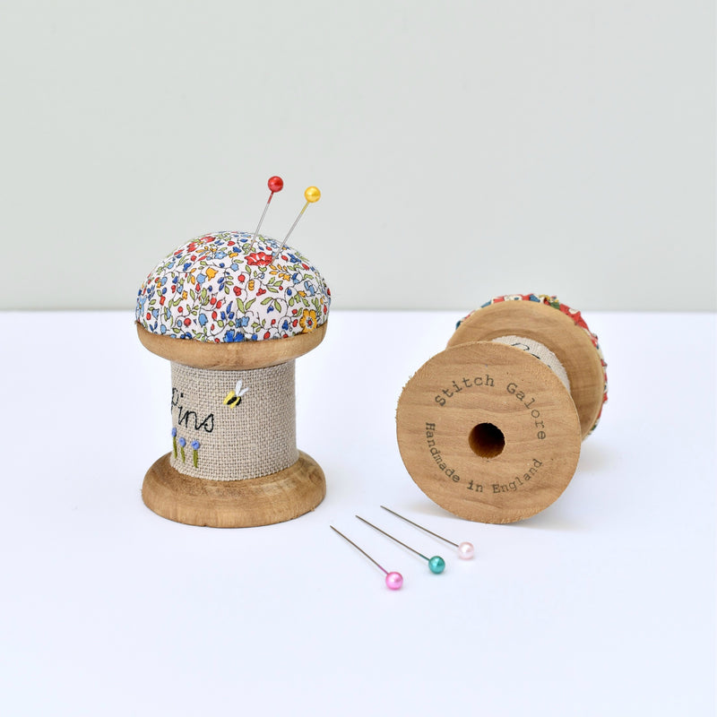 Pincushion, needle holder, sewing gift for made with a wooden bobbin and Liberty fabric handmade by Stitch Galore
