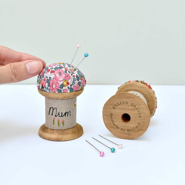 Embroidered personalised Mum pincushion, pin holder made using a wooden spool and Liberty fabric handmade by Stitch Galore