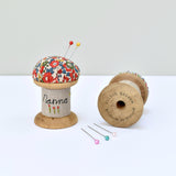 Pincushion, personalised sewing gift made with a wooden cotton reel and Liberty fabric handmade by Stitch Galore