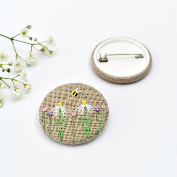 Sewn badge with flowers and bee, flower pin badge handmade by Stitch Galore 