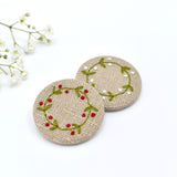 Embroidered holly wreath badge, holly pin badge handmade by Stitch Galore 
