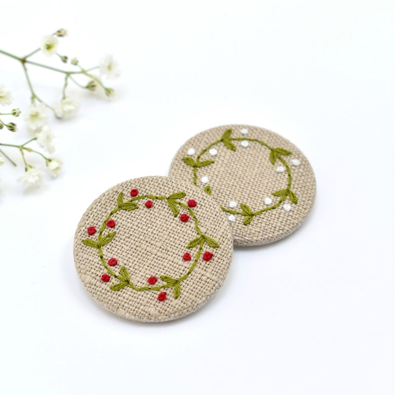 Embroidered holly wreath badge, holly pin badge handmade by Stitch Galore 