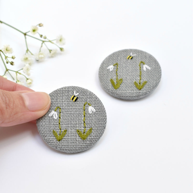 Sewn badge with snowdrops and bee, flower pin badge handmade by Stitch Galore 