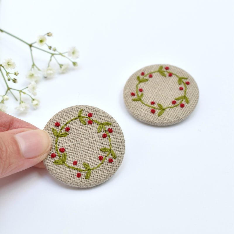Embroidered holly wreath badge, holly pin badge handmade by Stitch Galore 